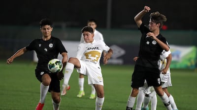 Pumas Unam (white) in action against the Manchester City Football Schools in the U14 Mina Cup final.