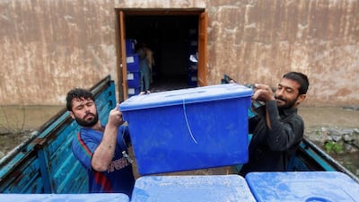 Afghan election commission workers load ballot boxes and election material to be transported to the polling stations in Jalalabad on April 2, 2014. Parwiz / Reuters