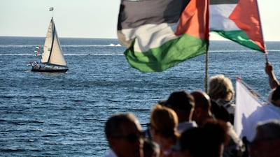 Activists wave Palestinian flags in support of a flotilla carrying humanitarian aid and activists vowing to try 'to break the siege of Gaza', in Ajaccio, Corsica. AFP