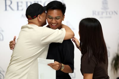 Johann Nicholas Francisco, centre, in celebratory mood. He will go on to study at the University of Woolongong in Dubai. Chris Whiteoak / The National