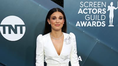 Millie Bobby Brown, wearing a white Louis Vuitton coat dress and trousers, attends the Screen Actors Guild Awards in Los Angeles on January 19, 2020. EPA