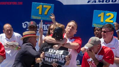 Mr Chestnut tackles the protester, putting him in a chokehold and throwing him to the floor. EPA