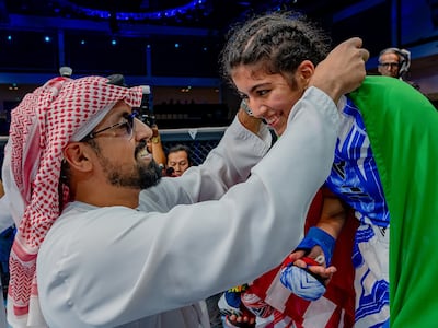 Sheikh Sultan bin Khalifa bin Shakbout presenting the gold medal to the UAE's Zamzam Al Hammadi at the Mubadala Arena on Saturday, August 10, 2024. Image: UAEMMAF
