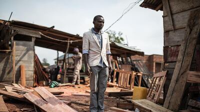 Jeannot, 28-years-old, Ebola virus survivor and deputy manager at a carpentry shop is seen inside the grouds of his workshop in Beni, north eastern Democratic Republic of the Congo on September 17, 2019. AFP