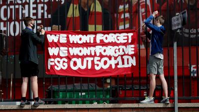 Liverpool fans put up a banner during the protest against American owners Fenway Sports Group over the aborted Super League project at Anfield. Reuters