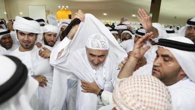 Ahmed Al Amash, celebrates his FNC election victory with his supporters in Ras Al Khaimah City in 2011. His supporters look forward to voting for him again if he runs for a second term on the council. Antonie Robertson / The National