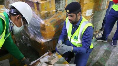 Boxes of fake iPhones are seized by customs officers in the UAE. Wam