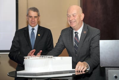 Philip Frayne, US Consul General in Dubai, (L) and Frederick Bush, Pavilion USA 2020 Chairman, (R) unveil the model of US Pavilion in November 2018. Pawan Singh / The National