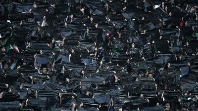 Saint-Etienne’s supporters hold black plastic bags during the UEFA Europa League football match between AS Saint-Etienne and Manchester United, at the Geoffroy Guichard stadium in Saint-Etienne, central France. Philippe Desmazes / AFP