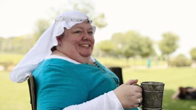 Joanne Labny aka Lady Fiona cools off with a drink of water in her pewter mug in Safa Park in Dubai.