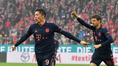 Robert Lewandowski, left, celebrates his goal for Bayern. AP