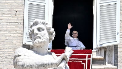 Pope Leo waves during a prayer at the Vatican on Sunday. AFP
