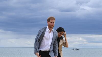 Harry and Meghan on the beach. EPA