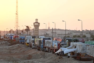 Lorries carrying aid queue on the Egyptian side of the Rafah border crossing with the Gaza Strip. AFP