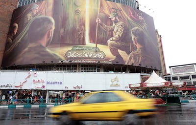 A billboard depicting a soldier carrying the Hezbollah flag, on a building at Valiasr Square in Tehran. EPA