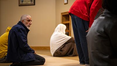 Bahrami's husband, Mohammad Saber Bahrami, participates in prayers at the mosque. AP Photo