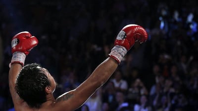 "I'm so happy," Manny Pacquiao said on Sunday, "because my time is not over." Tyrone Siu / Reuters