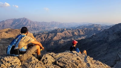 Hikers enjoy the striking views in Wadi Al Helo, the site of Bronze Age copper mines. Photo: Supplied