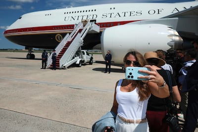 Journalists wait for Mr Trump's arrival next to the VC-25B Bridge, an interim Air Force One presidential aircraft, on the tarmac on August 04, 2026 in Joint Base Andrews, Maryland. AFP