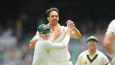 Mitchell Johnson of Australia is congratulated by Steven Smith after dismissing Lokesh Rahul of India during the final day of the third Test at Mebourne Cricket Ground on Tuesday. Scott Barbour / Getty Images / December 30, 2014