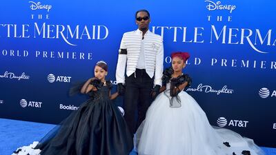 Offset, centre, and daughters Kulture Kiari Cephus, left, and Kalea Marie Cephus at the world premiere. AFP