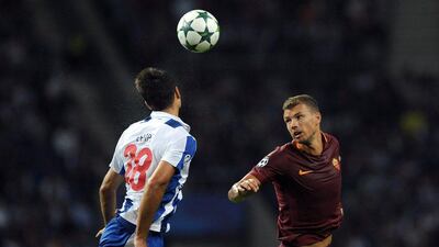 Porto's Felipe, left, and Roma's Edin Dzeko. Paulo Duarte / AP Photo / August 17, 2016