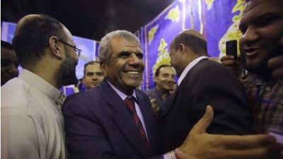 Sobhi Saleh, centre, a senior member of the Muslim Brotherhood and former member of parliament, is surrounded by supporters in Cairo.