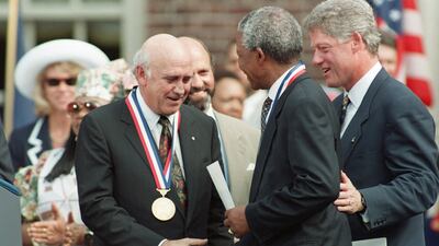 Former South African president FW de Klerk shakes hand with his successor, Nelson Mandela, as then US president Bill Clinton looks on in Washington in 1993. AFP