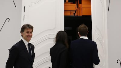 A huge wardrobe, stacked with Hermes boxes, conceals a hidden room beyond. Pawan Singh / The National