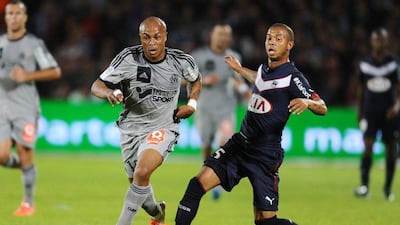 Andre Ayew, left, dring a Ligue 1 match with Marseille. Nicolas Tucat / AFP