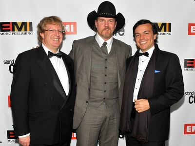 (L-R) Guy Hands, musician Trace Adkins and EMI Records president Elio Leoni-Sceti at the 2009 EMI Grammy after-party. WireImage