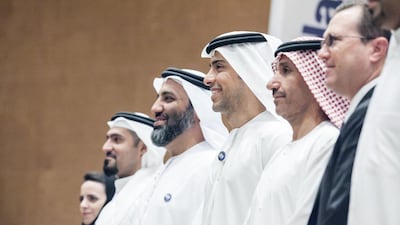 Mohammed Al Otaiba, Editor-in-Chief of The National, with Dr Mohammed Al Ahbabi, Director General of the UAE Space Agency, second right, and Peter McGrath, Director, Global Sales and Marketing, Space Exploration, Boeing, right, at the press conference. Silvia Razgova for The National
