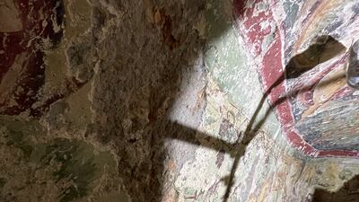 Light shines on the intricate paintings.