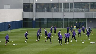 Manchester City players engage in drills during training. Oli Scarff / AFP