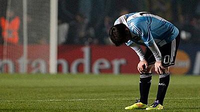 Lionel Messi is seen exhausted after the match against Colombia in Santa Fe. The match ended in a 0-0 draw.