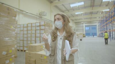 Bouran Najem, head of operations at International Humanitarian City, at a warehouse packed with relief aid at the International Humanitarian City. Courtesy IHC