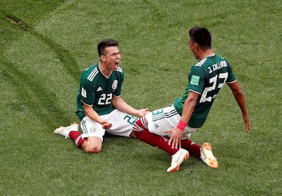 Mexico's Hirving Lozano celebrates scoring their first goal against Germany with Jesus Gallardo. Christian Hartmann / Reuters