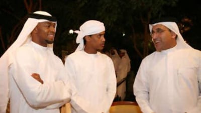 Ismail Rabee and Mohammed al Shehi chat with the UAE team manager Abdullah Hassan.