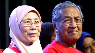 Former Malaysian prime minister Mahathir Mohamad and opposition leader Wan Azizah attend a rally in Petaling Jaya, near Kuala Lumpur, on October 14, 2017. Lai Seng Sin / Reuters