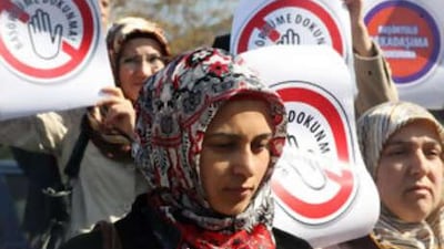 Women protest in front of Turkey's Constitutional Court against a ban on wearing Islamic head scarves in Ankara.