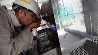 With temperatures soaring, many workers sought to cool themselves with water.