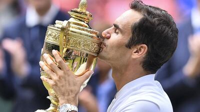 Roger Federer kisses the winner's trophy after beating Croatia's Marin Cilic in 2017. AFP