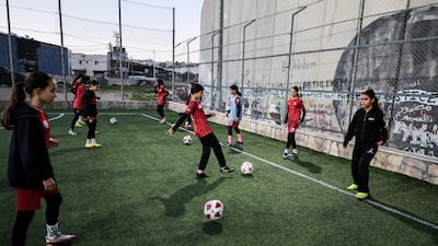 The football pitch that the Israeli military wanted to destroy is close to a security barrier between the West Bank and Israel. Reuters