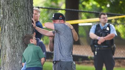 An adult and child take a moment while they leave the school as police respond to a shooting at the Annunciation Catholic School in Minneapolis, Minnesota, USA, 27 August 2025. According to police, two children and the gunman died and several were injured in the shooting at a Catholic primary church. EPA / CRAIG LASSIG