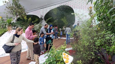 Visitors wander at the Butterfly House on Al Noor Island, a new, family-friendly tourist attraction in Sharjah. Satish Kumar / The National