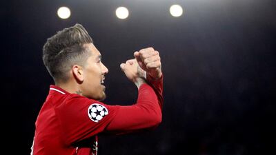 Liverpool's Roberto Firmino celebrates scoring their second goal. Reuters