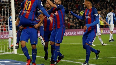 Barcelona players celebrate a goal against Espanyol. Albert Gea / Reuters