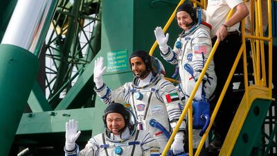 Hazza Al Mansouri, centre, Russian cosmonaut Oleg Skripochka, bottom, and US astronaut Jessica Meir, top, members of the main crew to the International Space Station (ISS), board the Soyuz MS-15 spacecraft for the launch at the Russian leased Baikonur cosmodrome in Kazakhstan on September 25, 2019. Maxim Shipenkov/Pool Photo via AP