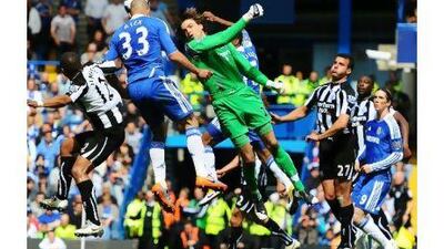 Alex, the Brazilian defender, scores Chelsea's second goal against Newcastle United yesterday. However, the London club had to settle for a point as Stephen Taylor scored an equaliser in injury time.