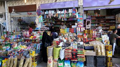 Iraqis shop for food during the holy month of Ramadan at market in western Baghdad, Iraq. EPA